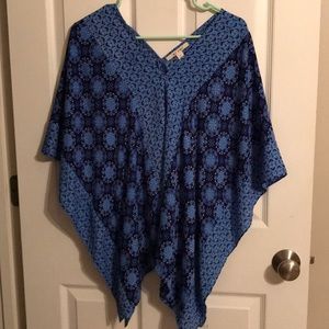 Poncho like shirt but has the arm space closed